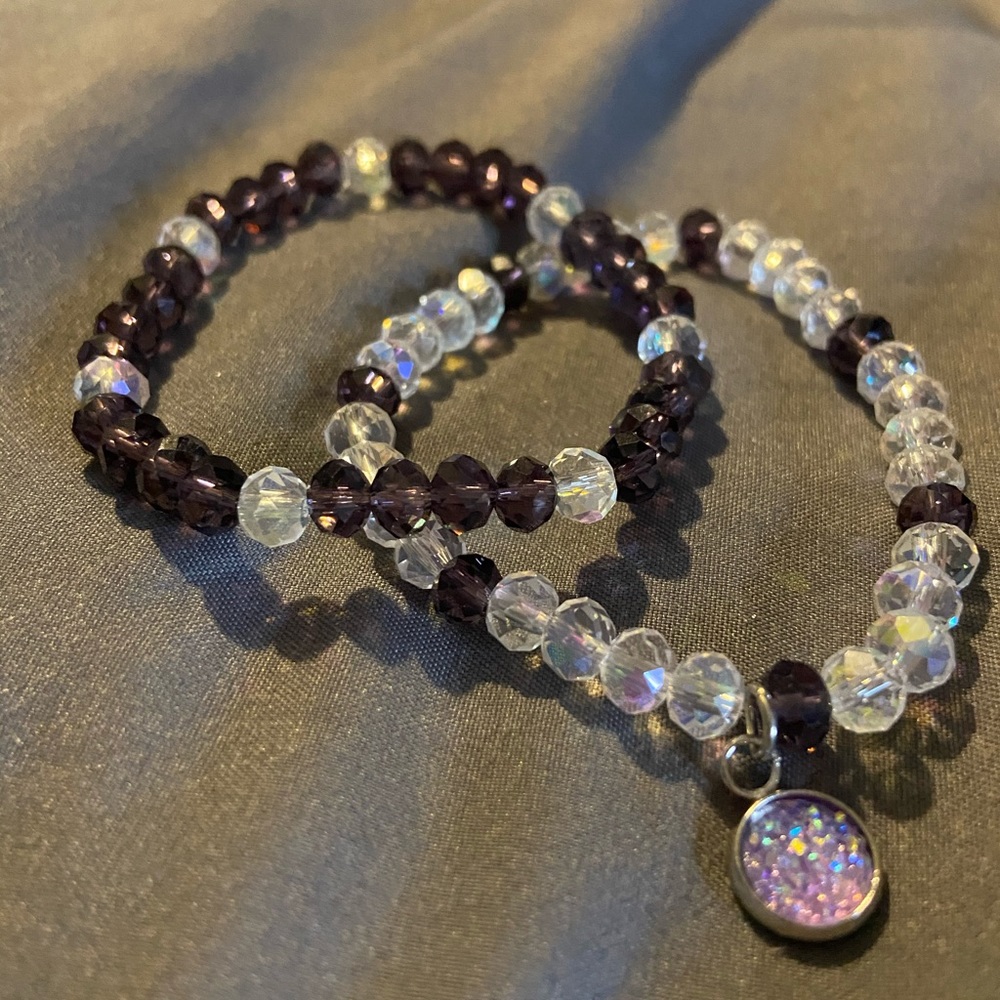 Purple and clear glass stretch bracelet with charm